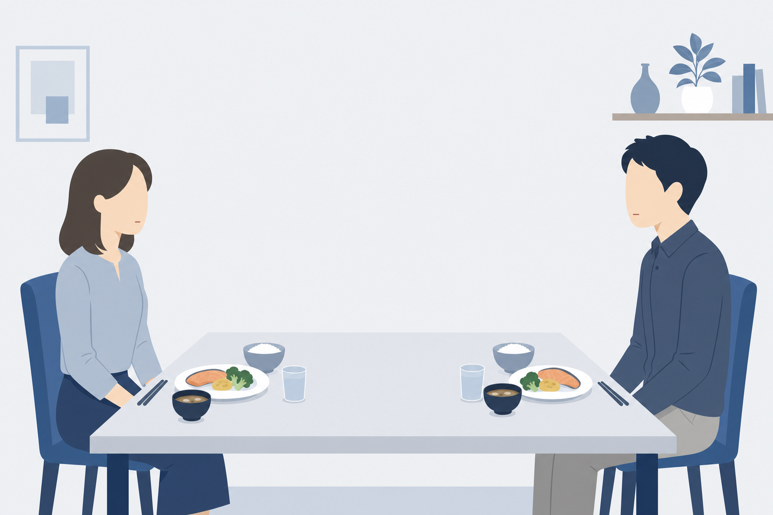 テーブルを挟んで向き合う夫婦。空気が冷えているような静かな食卓のシーン